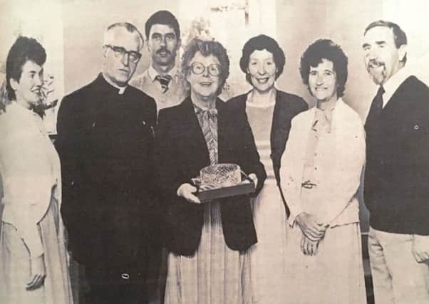 Mrs Dorothy McAlinden was presented with a Tyrone Crystal fruit bowl on her returement from St Patrick's Primary Aughacommon in 1984. Included are Seagoe PP Cannon JJ Petit, Mrs M Donnelly, Mr MK Kelly, Mrs P Smyth, Mrs E Nangle and principal Mr B Fagan
