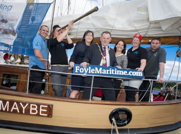 The Mayor of Derry City and Strabane District Council, Councillor Maoliosa McHugh pictured at the Foyle Maritime launch. Included with him are Seb Hall, First Mate and Grace Metcalfe, Skipper, Maybe, one of the tallships anchored portside at the weekend.