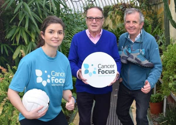 William McMullan (centre), who took on new challenges with ManPowered, with Maresa McGettigan and Gerry McElwee, from Cancer Focus NI.