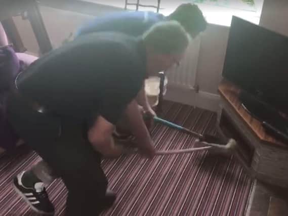 Two farmers from Northern Ireland hilariously attempt to catch a mouse. (Photo: Rachel Cochrane)