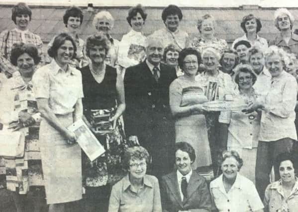 Mrs W Humphries, wife of the manager of Dunmanbridge Cheese Factory, Cookstown, presenting a silver salver to Mrs S Gillespie, winner of the MMB sponsored WI golfer of the year competition in 1978.