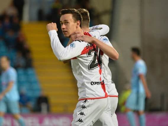 Paul Heatley bagged a brace as Crusaders secured an emphatic win over Ballymena United at the Showgrounds.