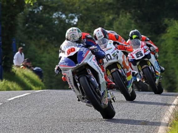 Peter Hickman leads Conor Cummins and Bruce Anstey in the Dundrod 150 Superbike race.
