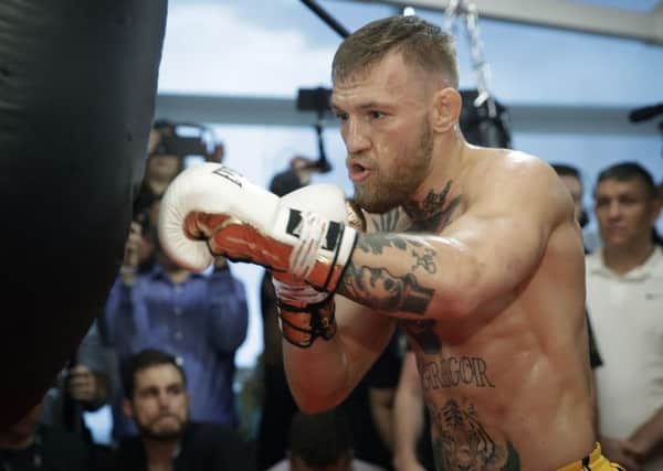 Conor McGregor trains during a media workout