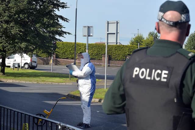 Police at the scene on the Garvaghy Road.