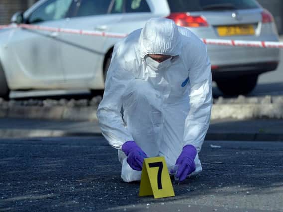 A police forensic officer at the Garvaghy Road.