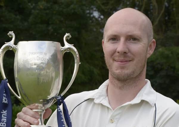 Paul McCart with a trophy during his time as Millpark captain