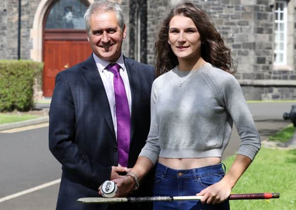 Jonny Brady, principal of St. Killian's College, with Double Ulster Schools' All-star camogie player Laoise McKenna who battled back from illness this year to score A grades in maths, chemistry, biology and Irish. 
Laoise captained Antrim to three titles in 2016 (All-Ireland Minor and the Ulster Minor and Intermediate double). Laoise has accepted a place to study pharmacy in Queen's. Pic by John McIlwaine.