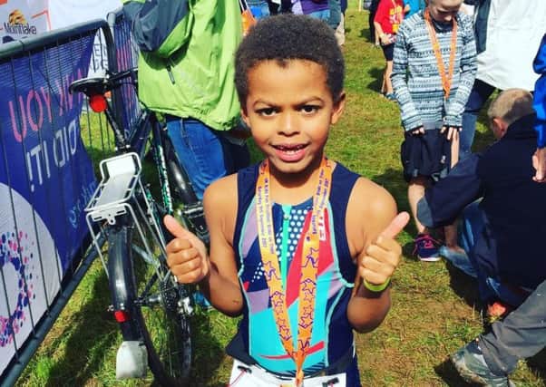 What a hero! Jacob Dumigan completed the triathlon for charity.