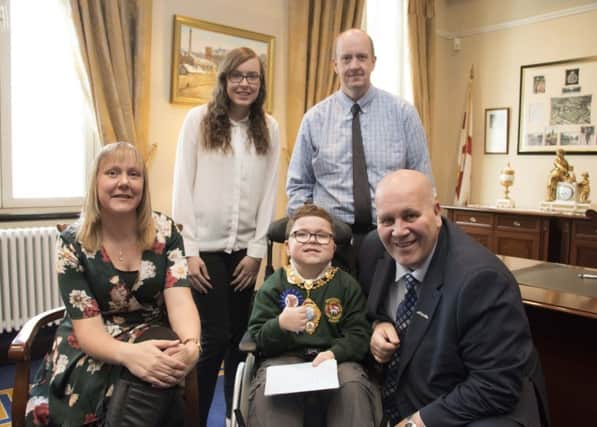 Ethan and his family are pictured with Mayor of Mid and East Antrim Borough Council, Cllr Paul Reid.  INBT 38-720-CON