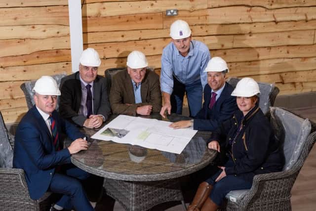 Richard Fry & Gary Hanna reviewing building plans for the new £5 million development at Coleman,s Garden Centre with local Councillors, MLA's and the local MP. Pictured left to right, Councillor Paul Michael, Trevor Clarke MLA South Antrim, Richard Fry, Coleman's Garden Centre, Gary Hanna, May Estates, Paul Girvan MP South Antrim and Pam Cameron MLA South Antrim.