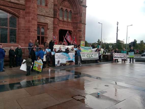 Protestors outside the Guildhall this afternoon.