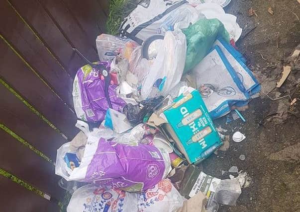 Rubbish that was recently dumped in the Queens Park estate.