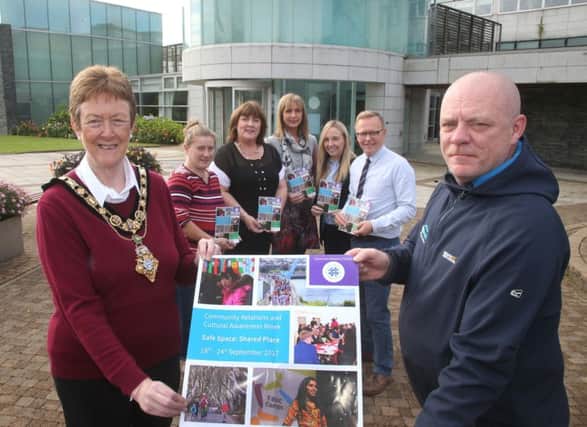 The Mayor of Causeway Coast and Glens Borough Council, Councillor Joan Baird OBE, helps to launch the Causeway Prejudice Challenge with assistance from Josey Grogan from Springboard. In the background are Lorraine Coulter, Joy Wisener, Patricia Cameron, and Jonny Donaghy from councils Good Relations team and Steph ORourke (second, right) from Springboard. INCR 38-701-CON GOOD