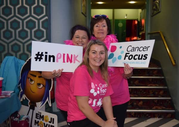 The Cancer Focus NI team (l-r) Wendy Brown, Rosie Forsythe from Islandmagee and Deirdre Conlon get all pinked up for breast cancer awareness month in October to raise cash for breast cancer research at Queens University Belfast