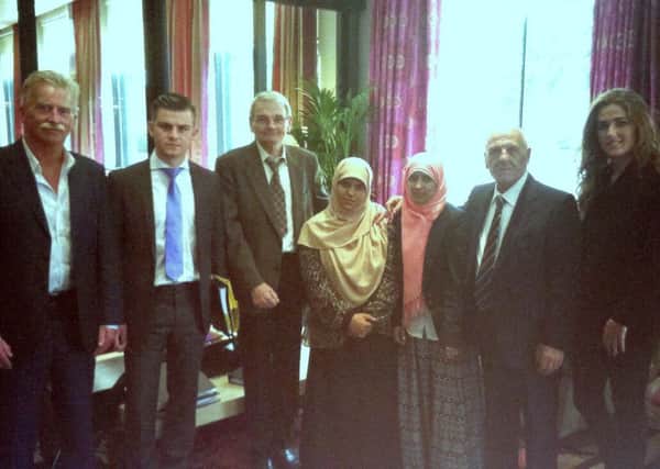 Jim McIlmurray, Darragh Mackin, Brian Turley, Kevin Hannaway and Katie Dowling with sisters Somaia and Fatima Halawa in Dublin recently to highlight their case.
