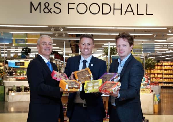 Genesis Crafty Managing Director, Brian McErlain, (left) and JP Lyttle, Commercial Director (right) launch the new small cake lines at M&S Sprucefield with Ryan Lemon, M&S Head of Region Northern Ireland and IOM (centre).
 Mandatory Credit Â©Press Eye/Darren Kidd