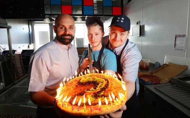 Scott Higginson (left), managing director of Four Star Pizza in Carrick, with team members Declan Fitzsimmons (centre) and Paul Browne (right) mark the booming restaurants second birthday.