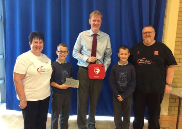 Fourtowns Primary School were pleased to receive a presentation of a Defibrillator from Karen and David Lowry of the Stephen Lowry Memorial Trust.