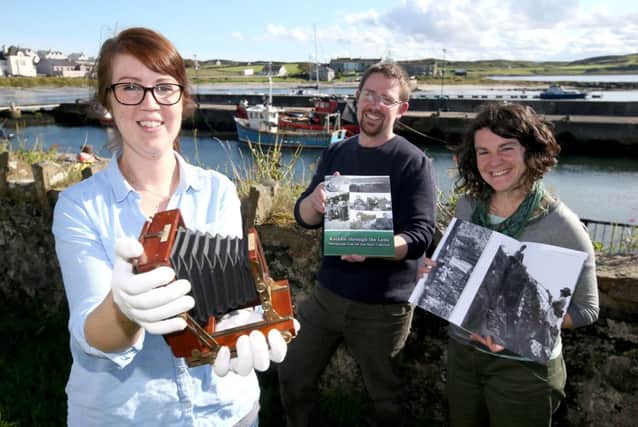 Sarah Carson Nic Wright and Bryonie Roed with one of Sams Camera and the Book that was launched today on Rathlin Island,the Sam Henry Rathlin Island book that was launched this afternoon on the Island.The Rathlin material captures life on the island dating back to the early part of the
20th century. Sam Henry (1878 Ã¢Â¬ 1952) worked as a Pensions and Excise Officer, but he
was also an avid folklorist, historian, photographer, ornithologist, naturalist,
genealogist and musician. In 1906, he bought his first camera and visited the island
several times which allowed him to build up a striking photographic collection. He
collected stories from the islanders, along with their folklore and songs.PICTURE KEVIN MCAULEY/MCAULEY MULTIMEDIA