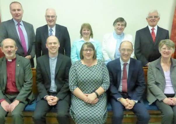 Devina Park, recently ordained and installed as an elder in Magheramorne Presbyterian church, is pictured here with the members of the Carrickfergus Presbytery commission who conducted the service.