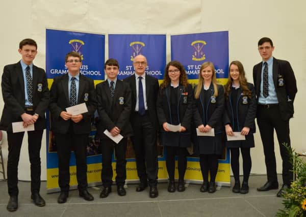 St Louis pupils who achieved 10 A-Astars at GCSE  James McKeown, Padraig McKee, Liam O'Connell, Natasha Selby, Mollie O'Brien, Katharine Mullan, Conor Stewart with special prize distribution guest, Jamie Delargy.