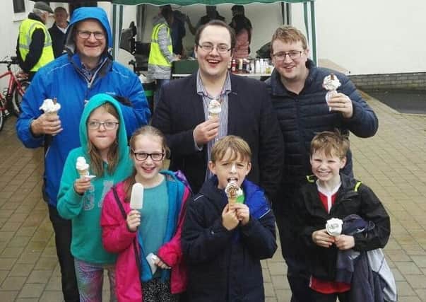 Ulster Unionist Councillors Tim Mitchell, Alexander Redpath and Nicholas Trimble with family and friends at the Elmwood Presbyterian Church Community Carnival Day.