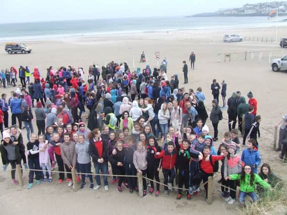 Loreto College students and staff on Portstewart Strand during their fundraising beach walk.