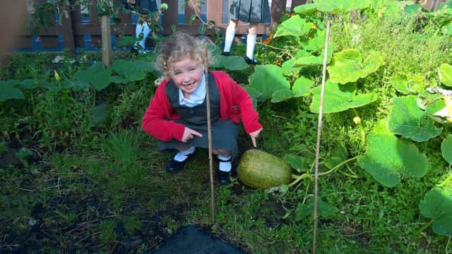 Exploring the school garden for artistic inspiration.