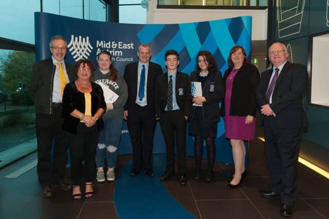 Speaker Quintin Oliver, Councillor Geraldine Mulvenna, Alexandrea Rosbotham, Peter McKittrick of the U.S. Department of State in Belfast, Eoin Agnew and Eabha Lynn from St. Louis Grammar School, and Councillors Maureen Morrow and Billy Ashe.