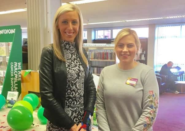 Carla Lockhart MLA (left) with library assistant Ciara Byrne at the coffee morning fundraiser in Banbridge Library.