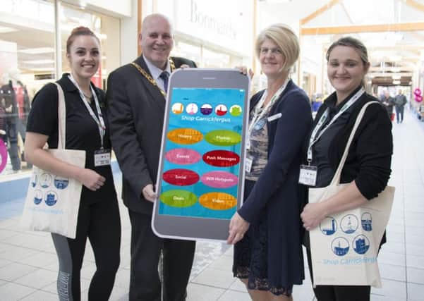 Mayor of Mid and East Antrim, Cllr Paul Reid, is pictured with Rimante Budriene of Alfies Coffee Shop, Linda McCullough from Danske Bank and Charlene Andrews of Dobbins Inn Hotel to promote the new Shop Carrickfergus App.