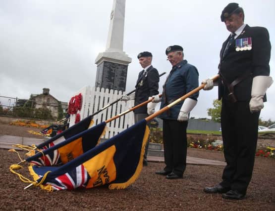 Lowering the standards at Ballycastle War Memorial to mark the sinking of HMS Drake at Church Bay Rathlin Island on 100 years ago today. KEVIN MCAULEY/MCAULEY MULTIMEDIA