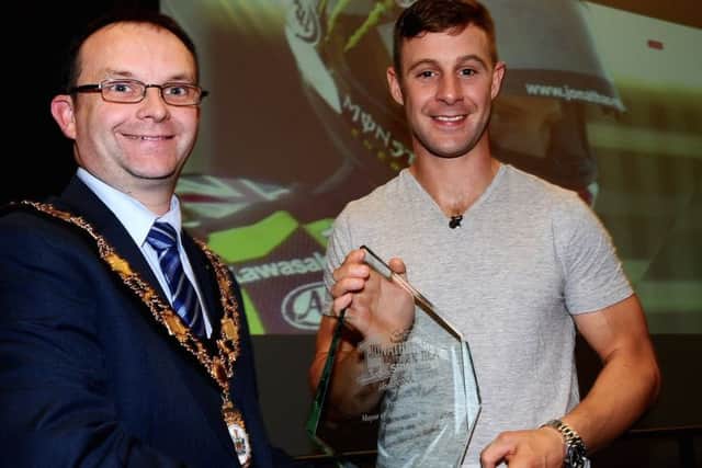 Mayor of Antrim and Newtownabbey Borough Council, Cllr Paul Hamill presents Jonathan Rea with a trophy during the special event at the Sixmile Leisure Centre.