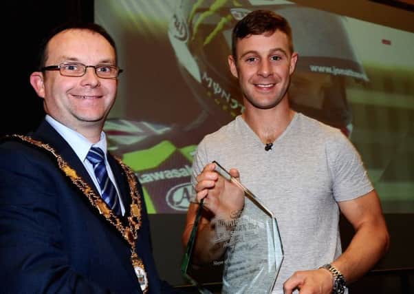 Mayor of Antrim and Newtownabbey Borough Council, Cllr Paul Hamill presents Jonathan Rea with a trophy during the special event at the Sixmile Leisure Centre.
