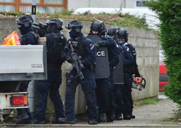 PACEMAKER BELFAST   13/03/2017: Heavily armed police squad on the streets of Carrickfergus in the immediate aftermath of the murder of George Gilmore.