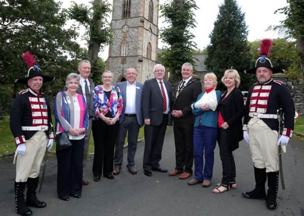 Former pupils of Downshire Primary School who travelled from as far away as Japan, Australia and Canada pictured at their 60 year school reunion with Alderman Allan Ewart MBE, Mayor Tim Morrow and the Hillsborough Old Guard.
