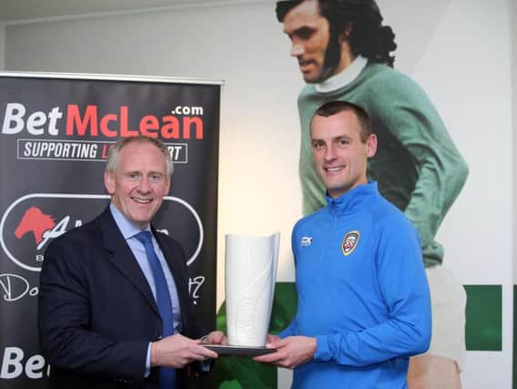 Paul McLean presents Coleraine boss Oran Kearney with the BetMcLean Manager of the Month award for September.