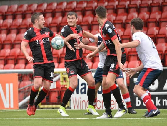 Crusaders defeated Cove Rangers to reach the last eight of the IRN BRU Cup