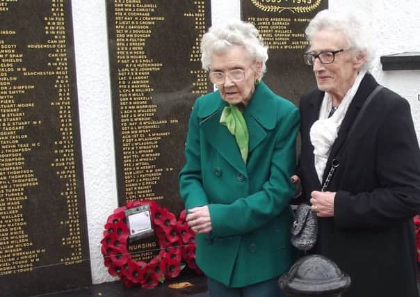 Francis McCluskey's cousins, Patricia McCluskey and Alice O'Brien, lay a wreath in his memory at Ballymoney War Memorial
