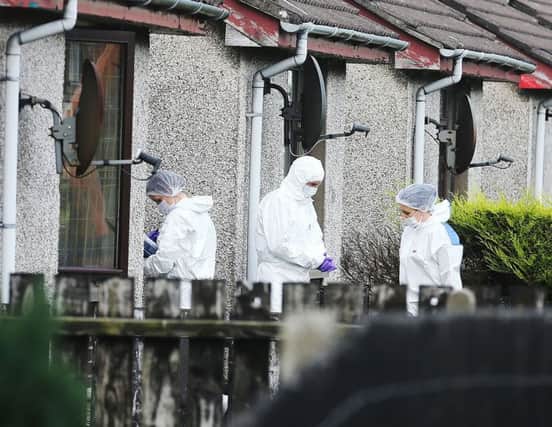Forensics officers at the scene of a suspicious death in Larne.  Picture: Pacemaker