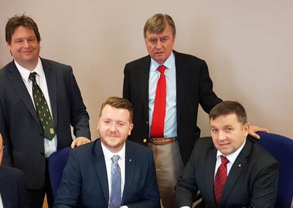 Cllr McCarthy (centre) pictured with UUP leader Robin Swann MLA, Ald Mark Cosgrove and Ald Fraser Agnew.