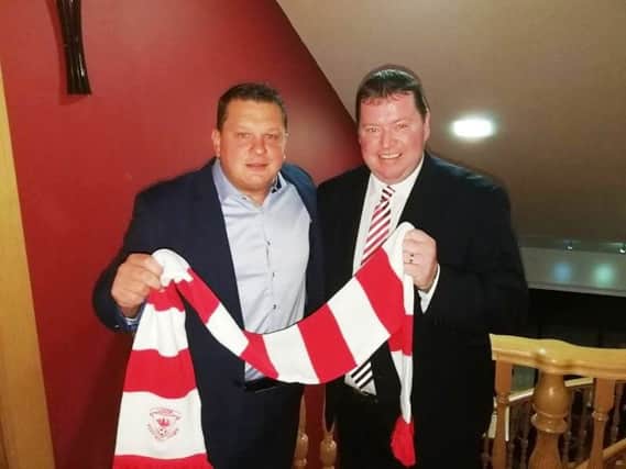 Kenny Bruce, Purplebricks estate agents, and Gareth Clements, chairman Larne FC, met with supporters on Monday evening.
