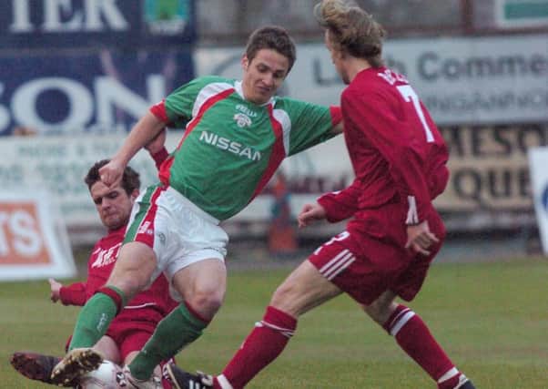 Kevin Doyle between Portadown's Cullen Feeney and Wesley Boyle for Cork City in 2005 at Shamrock Park. Pic by Pacemaker.