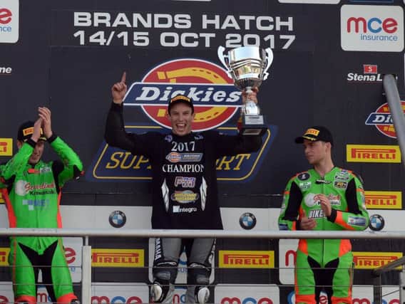 Keith Farmer celebrates on the podium at Brands Hatch with championship runner-up Andrew Irwin (left) and Ben Currie, who finished third in the standings.