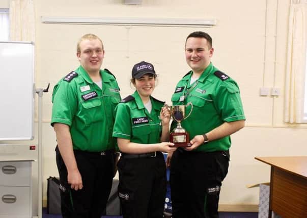Jemma, Darren & Martin - Jemma Catlin being presented with the Area Cadet of the Year Cup by Darren McDonagh, Northern Area Youth Officer. Pictured with Martin OKane, Ballymena Cadet Unit Leader.