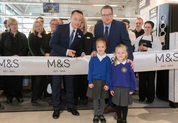 Pictured opening the new store are: Michael Gillen, M&S Aldergrove Store Manager, Tony Young, Principal of Straidhavern Primary School, and pupils Isabel Lyall and Brooke Jones, who won a colouring-in competition to celebrate the opening of the new store.