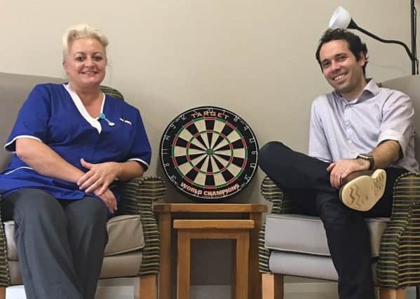 Staff member Denise Campbell and Wood Green manager Tiago Moreira are hoping to create a gentleman's club at the care home