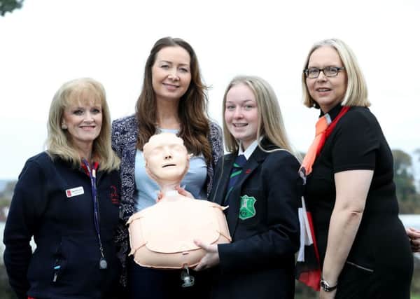 Fort Hill Integrated College pupil Melissa Doyle with her mum Clare Hamilton, school nurse Eileen McConnell and Head of BHF NI Jayne Murray.