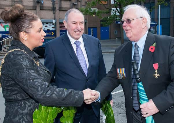 Sinn Feins Elisha McCallion shakes hands with Glen Barr before  the annual commemoration service of the Battle of Messines at Londonderry Cenotaph in 2015. Also pictured is Sinn Feins former Assembly speaker Mitchel McLaughlin